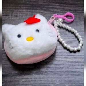 Hello Kitty Purse, with three lip gloss...Brand New Never Used